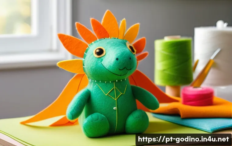 고고다이노 캐릭터 인형 DIY 튜토리얼 - A detailed crafting workspace showing a vibrant Gogodino plush doll made from soft felt fabric in br...